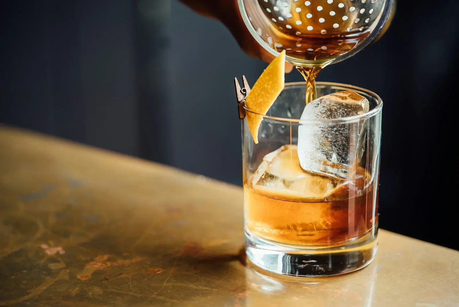 A cocktail being poured over ice at a Gustavia bar in St Barts