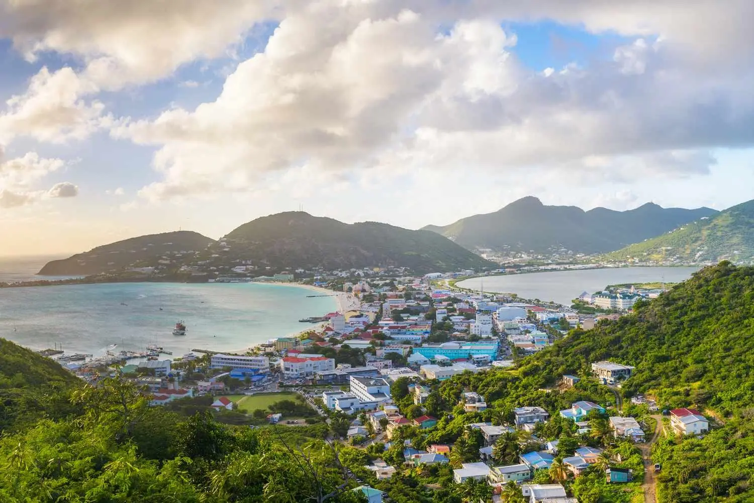 The hills of Saint-Martin and a wide bay seen from above the town